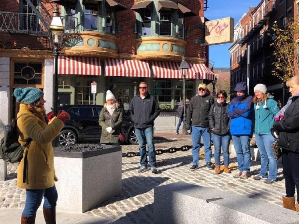 a group of people walking down a street